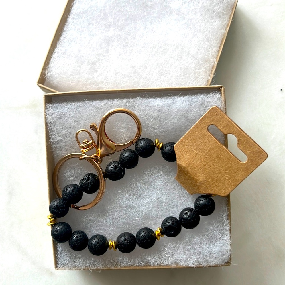 Lava stone bracelet and gold tone keychain